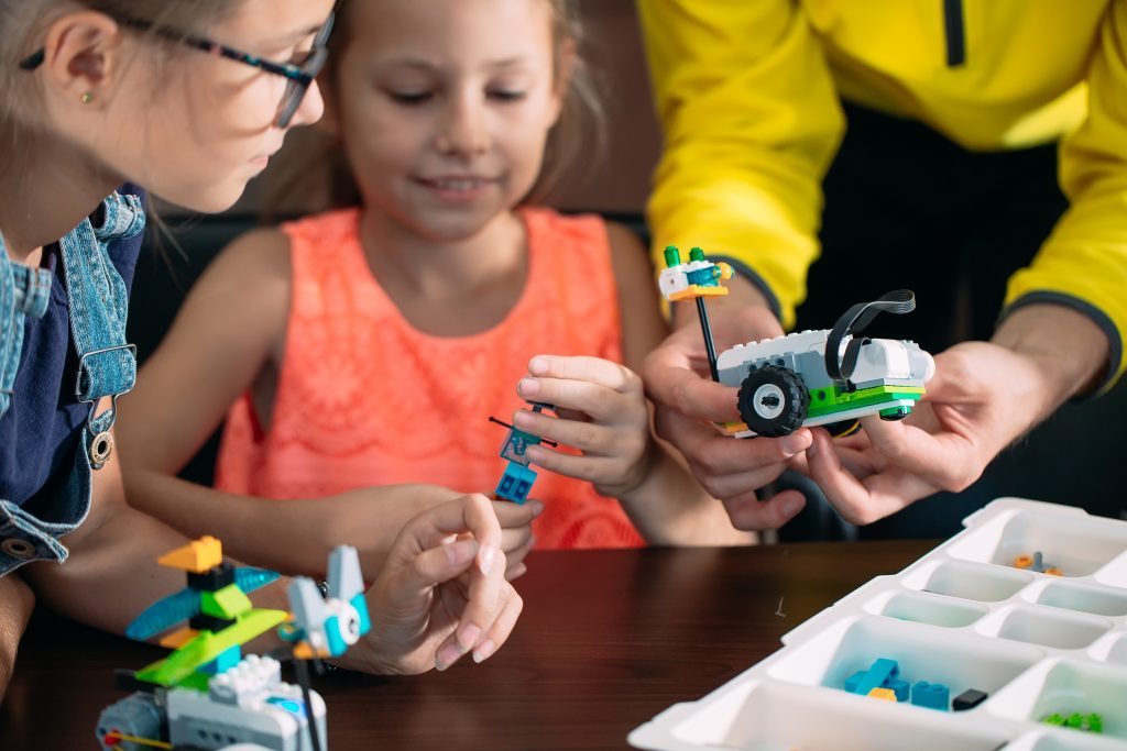Kids building with Lego blocks